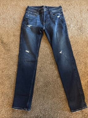 Hollister Men's Skinny Jeans in Dark Blue with Distressed Details